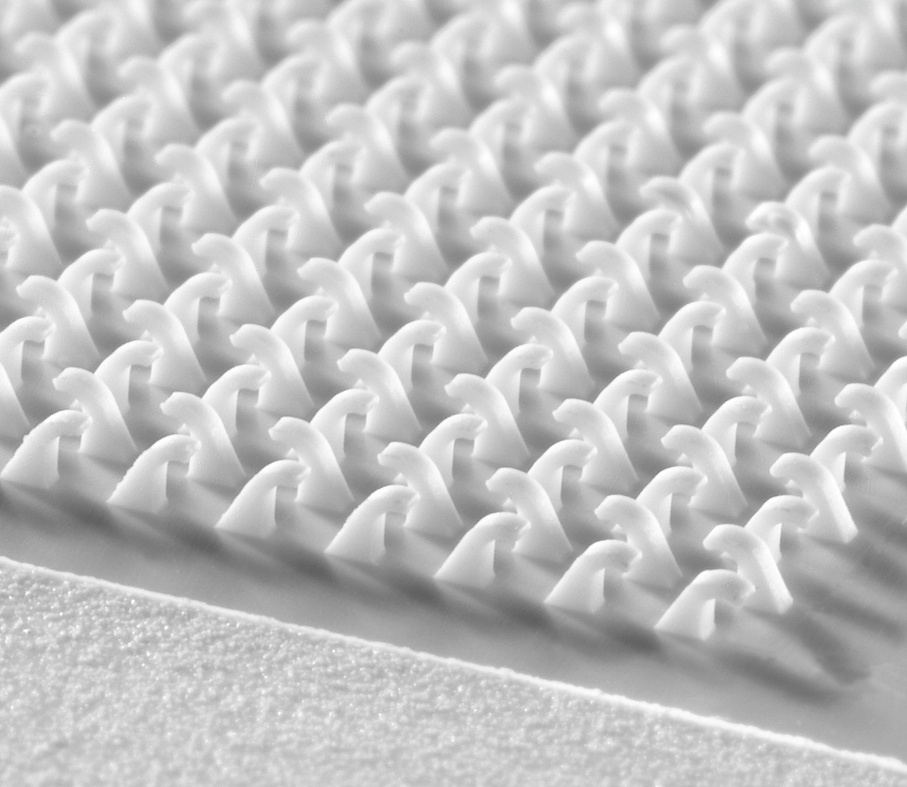 Macro close-up of inter-mold® injected plastic hook field